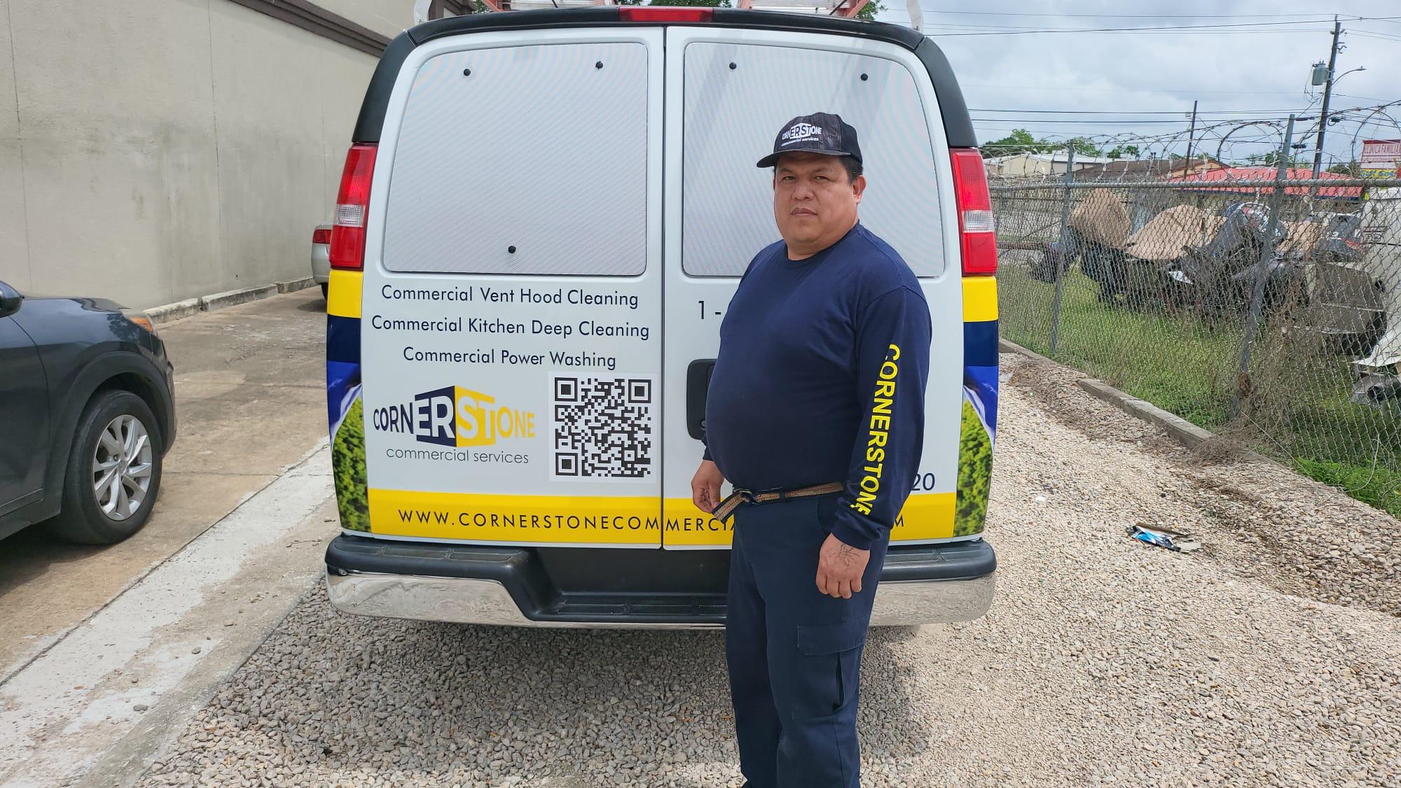 Cornerstone technician cleaning a commercial kitchen hood vent
