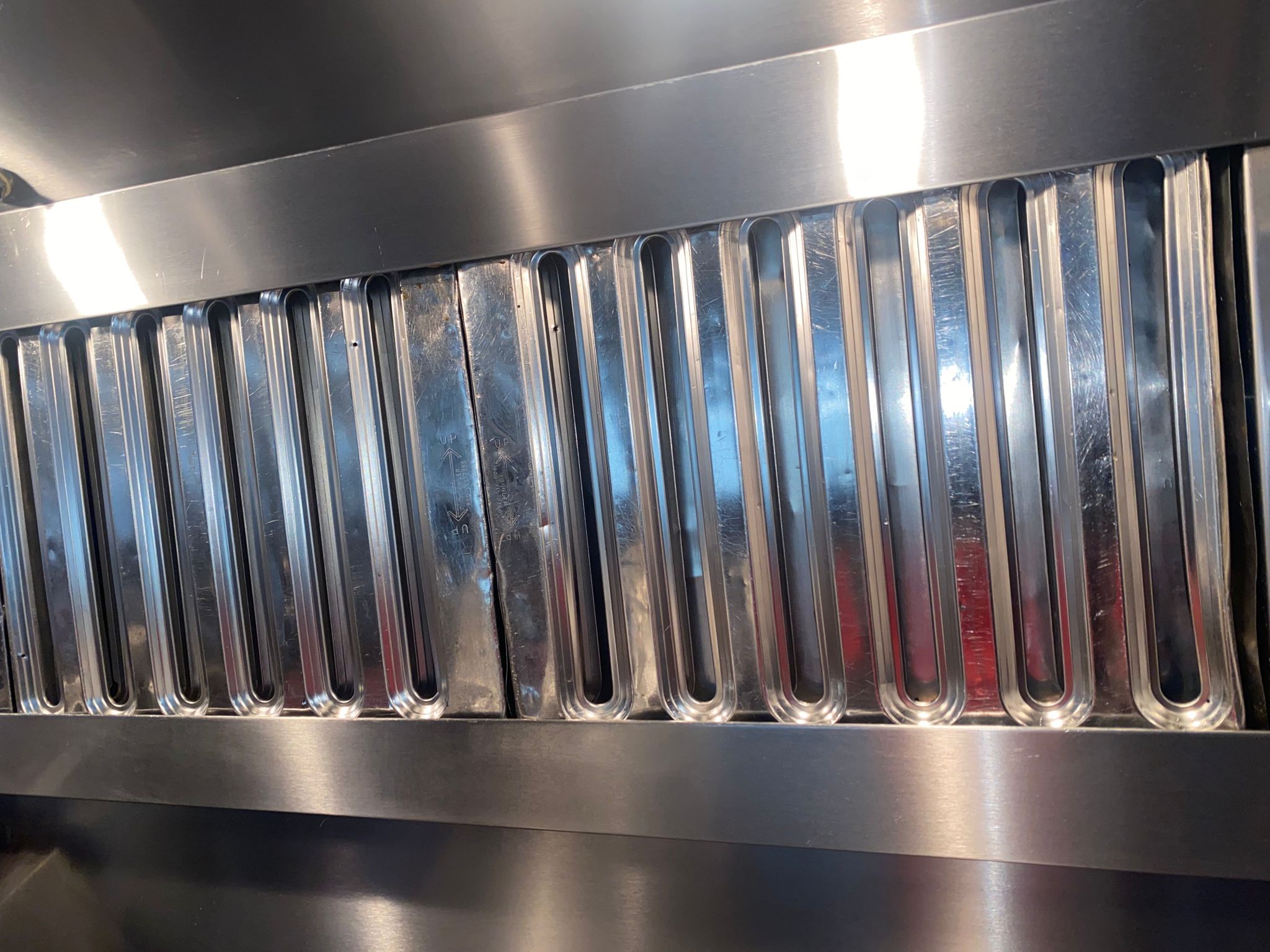 Ventilation hoods above a large institutional kitchen