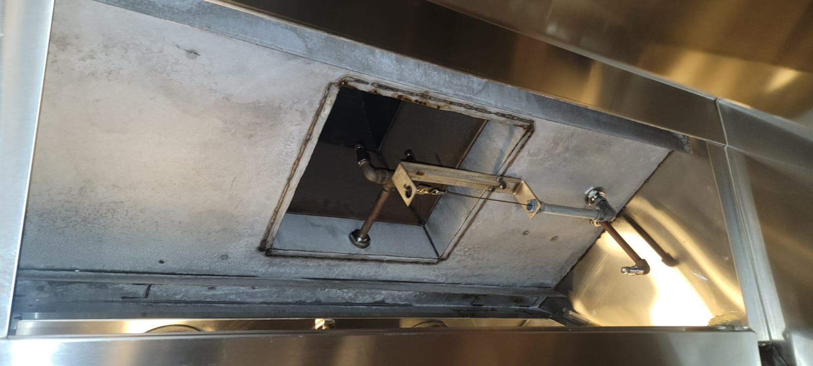 Cornerstone technician scrubbing a kitchen exhaust hood