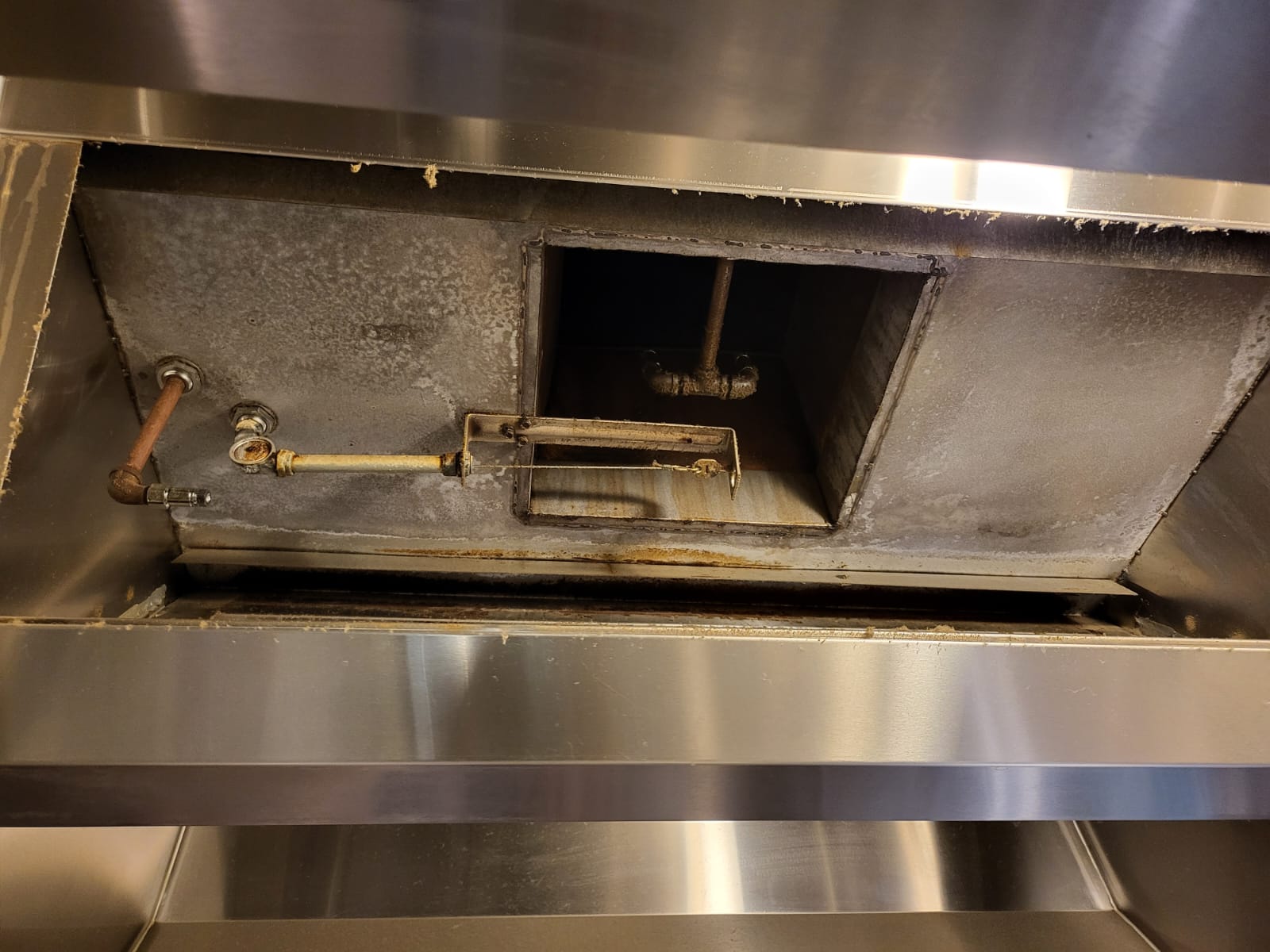 Ventilation hoods above a large institutional kitchen