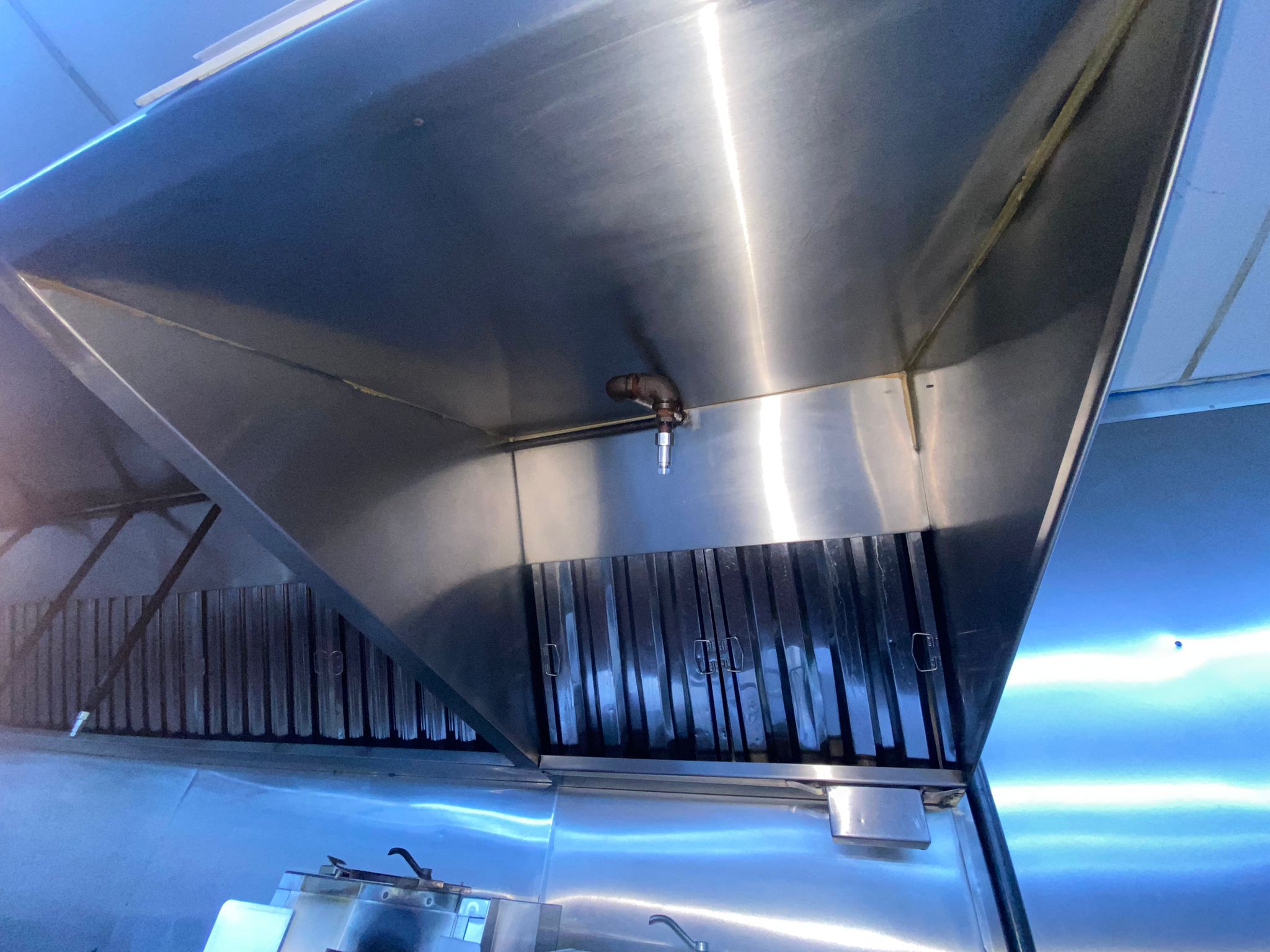 Cornerstone technician scrubbing a kitchen exhaust hood