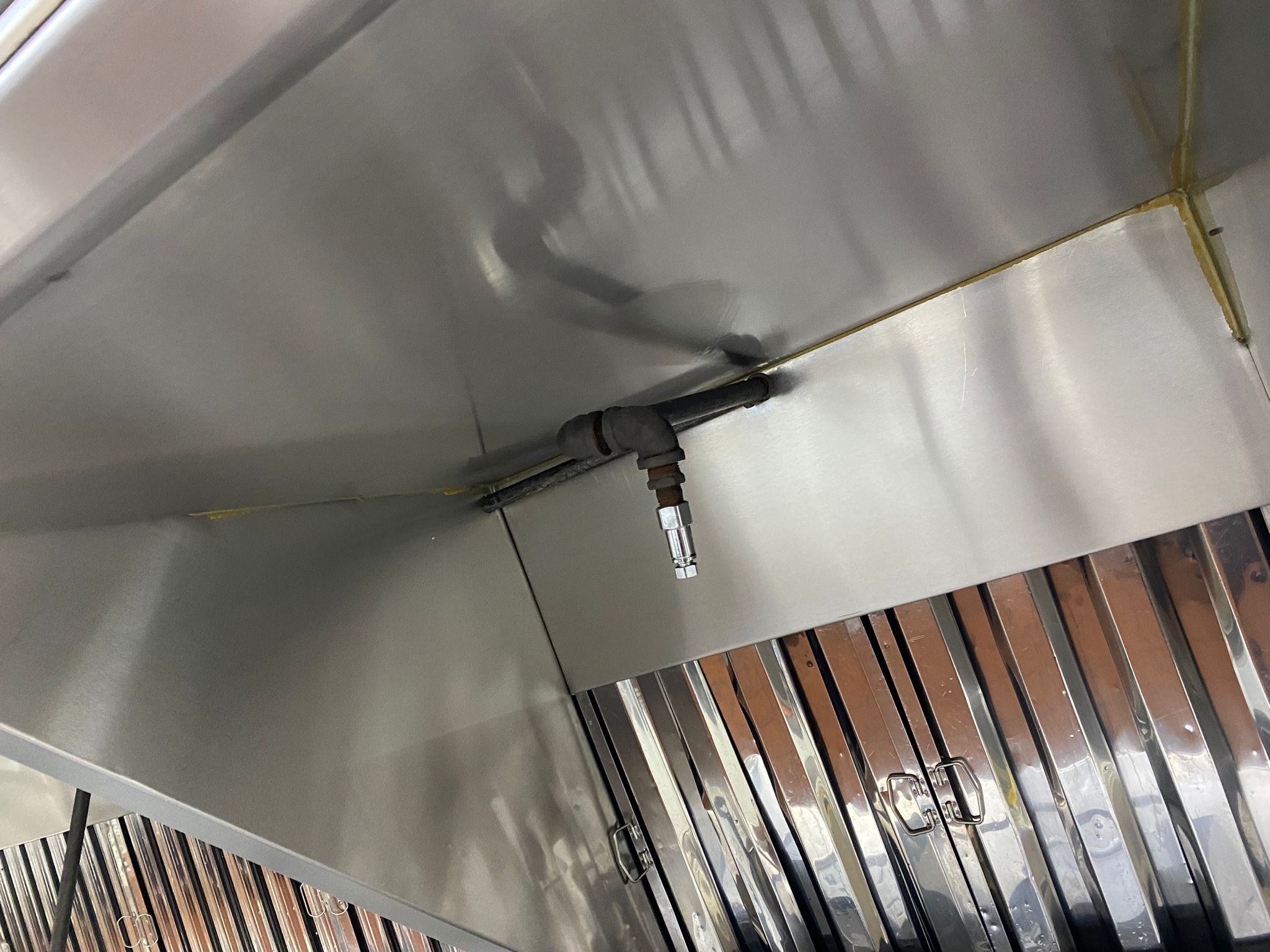 Ventilation hoods above a large institutional kitchen