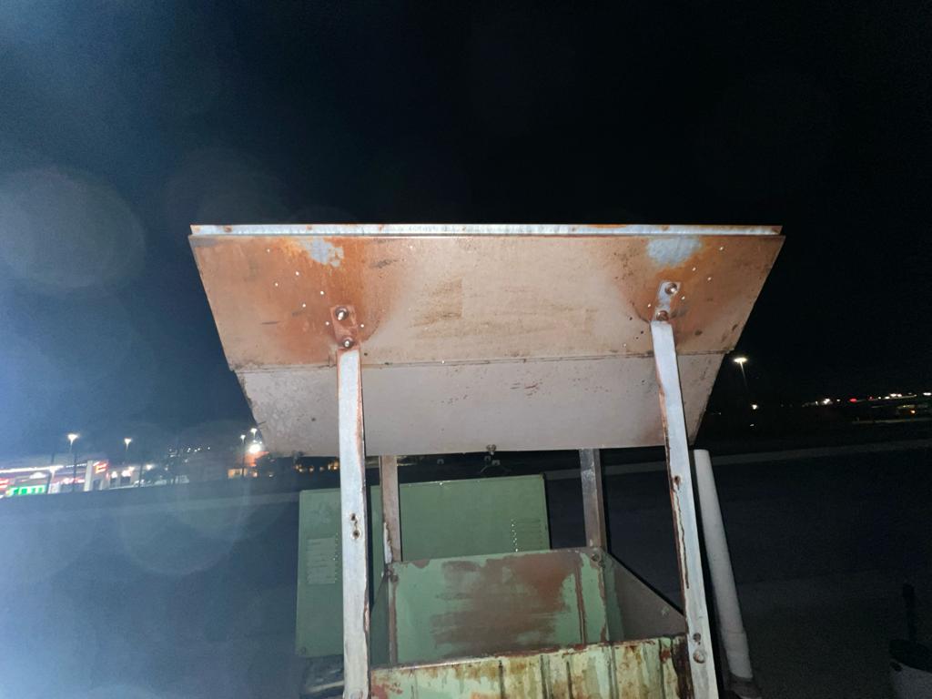 Chef cooking on a restaurant range beneath an exhaust hood