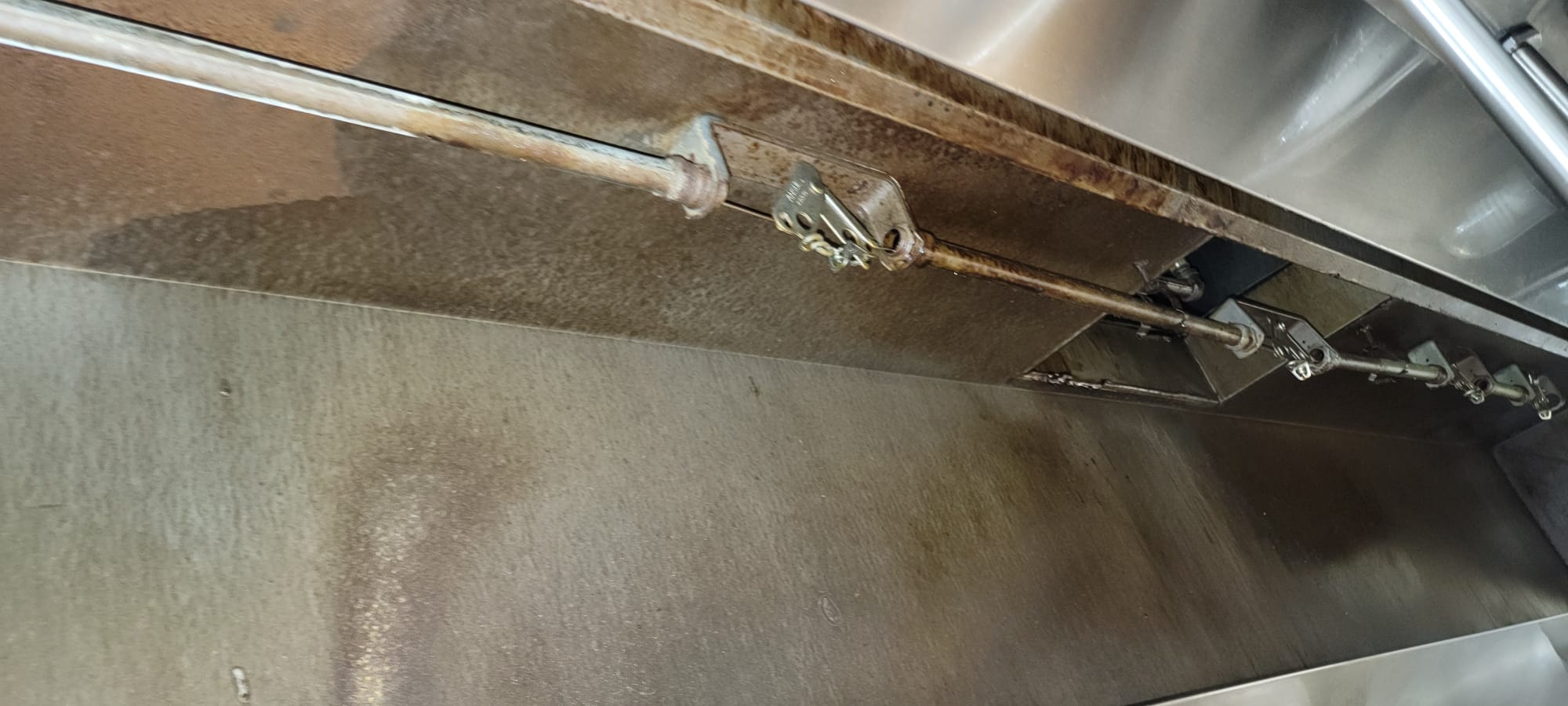 Ventilation hoods above a large institutional kitchen