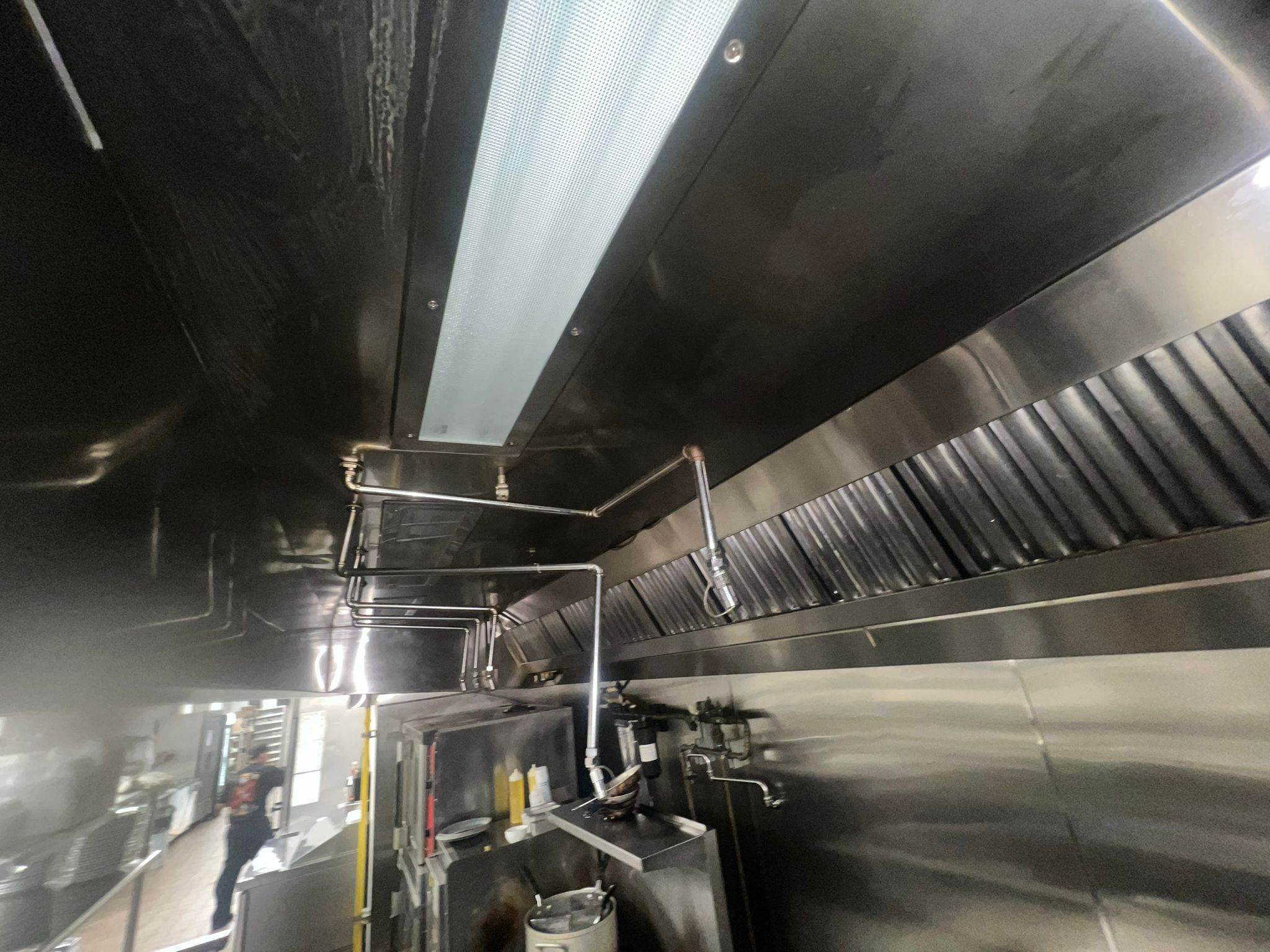 Cornerstone technician scrubbing a kitchen exhaust hood