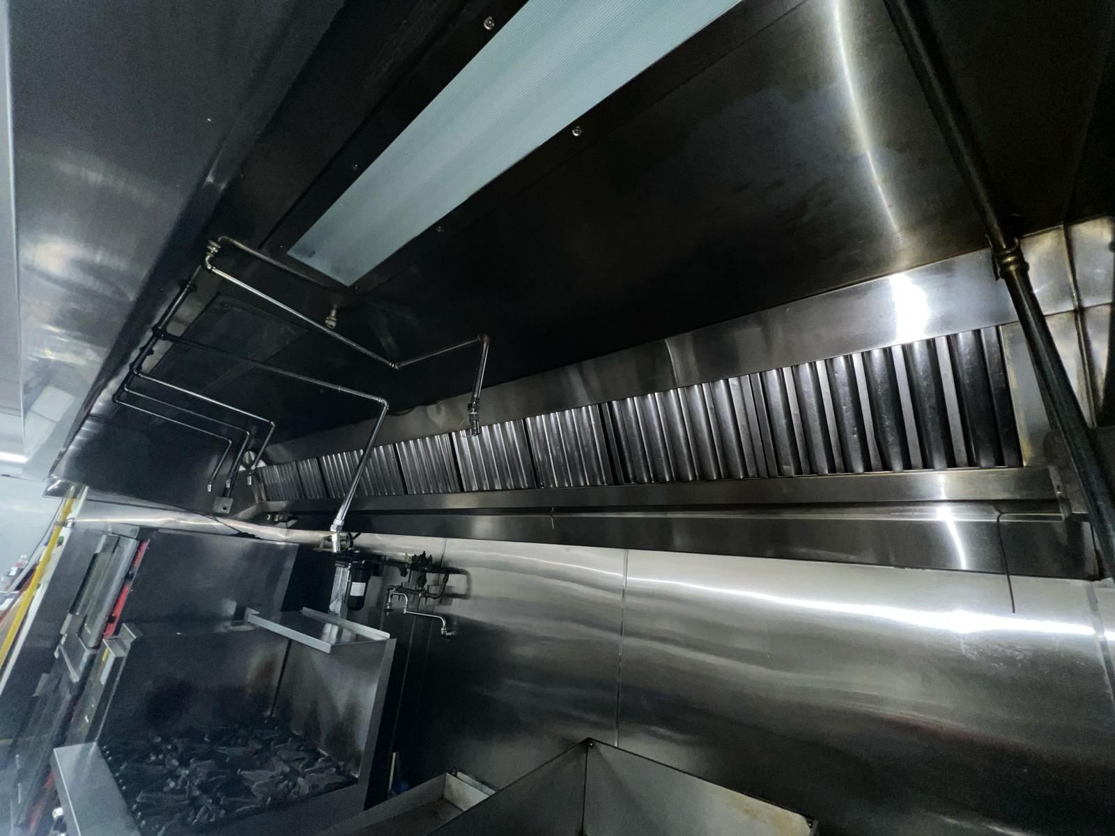Ventilation hoods above a large institutional kitchen