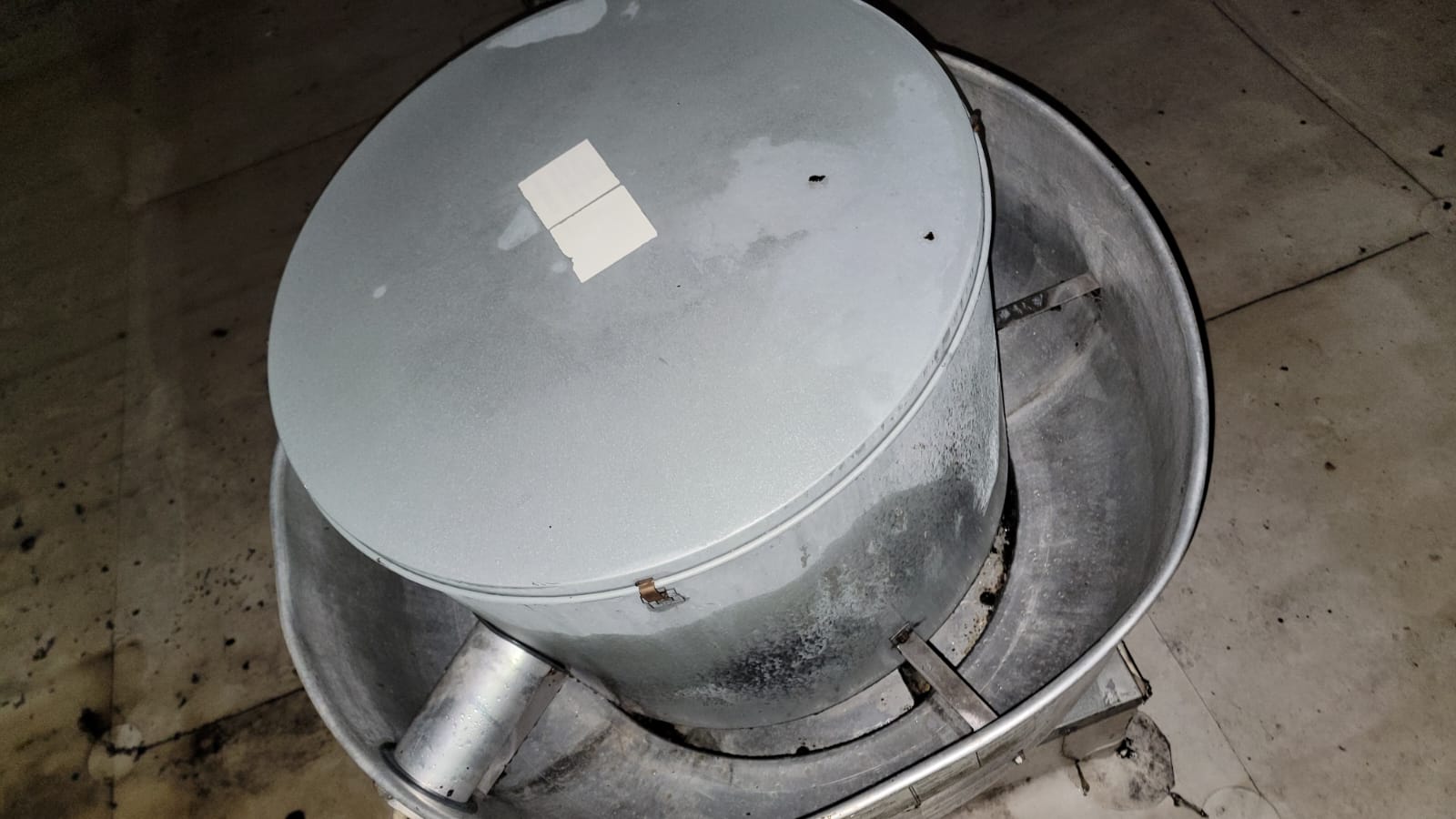 Chef cooking on a restaurant range beneath an exhaust hood