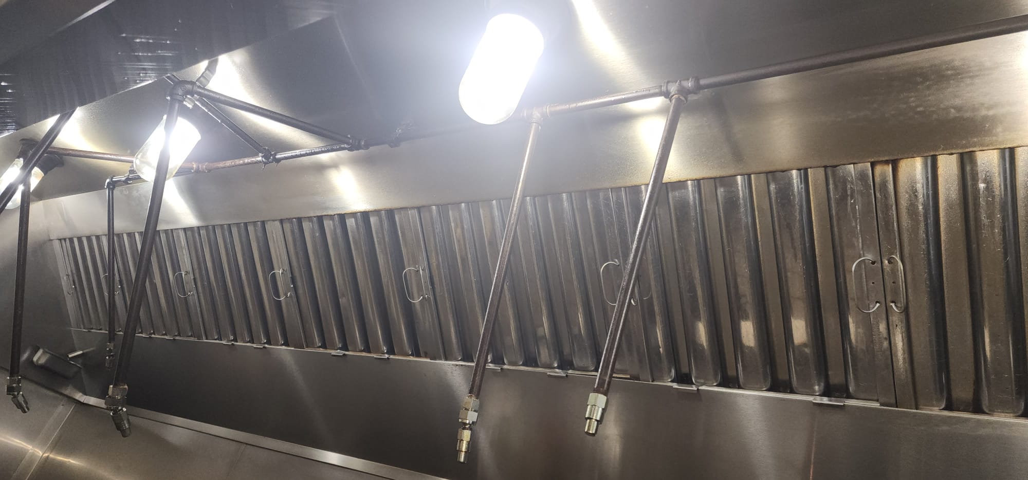 Ventilation hoods above a large institutional kitchen