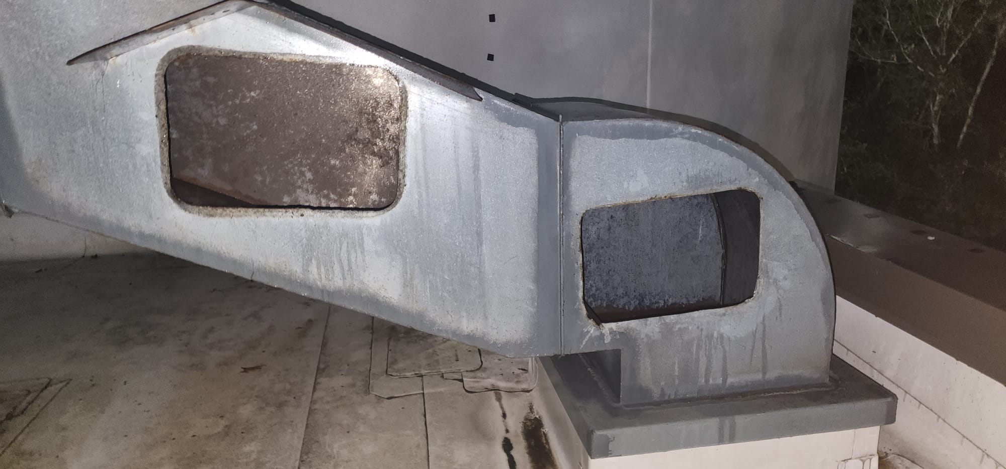 Stainless steel hood over a commercial kitchen cook line