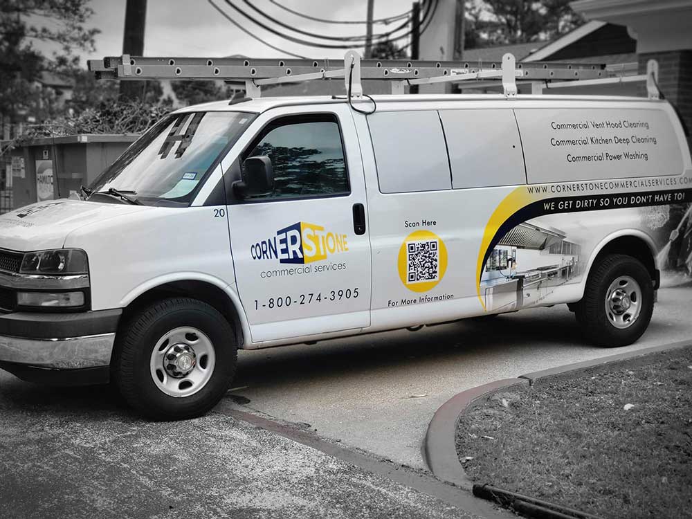 Cornerstone van reading "We get dirty so you don't have to" with services and phone number on the side